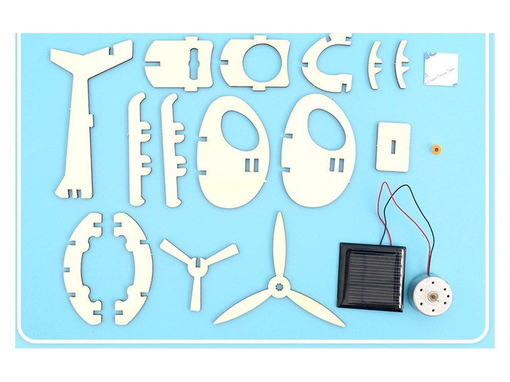The Solar Helicopter kit as supplied, with every plywood piece, the solar panel, the motor and the rotor laid out