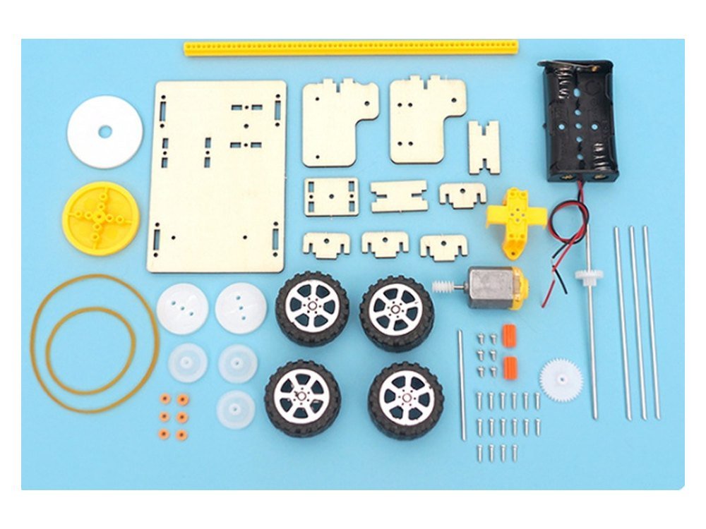 The Sweeping Robot kit as supplied, with every plywood piece, wheel, pulley, gear, band, shaft and the motor laid out